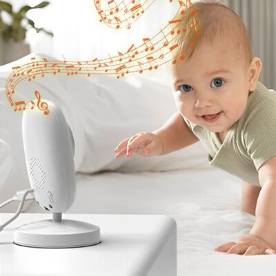Bébé vêtu vert heureux et attiré par douces sonorités caméra bébé vision claire