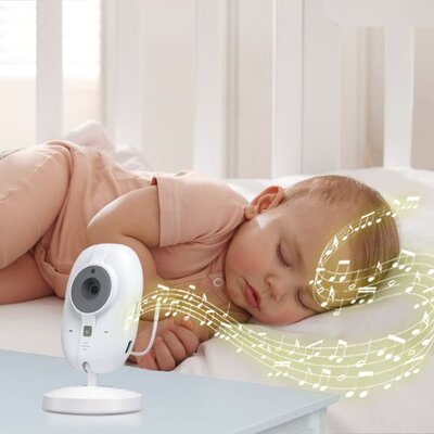 Vue profil bébé vêtu rose endormi sous douces sonorités caméra bébé vision claire